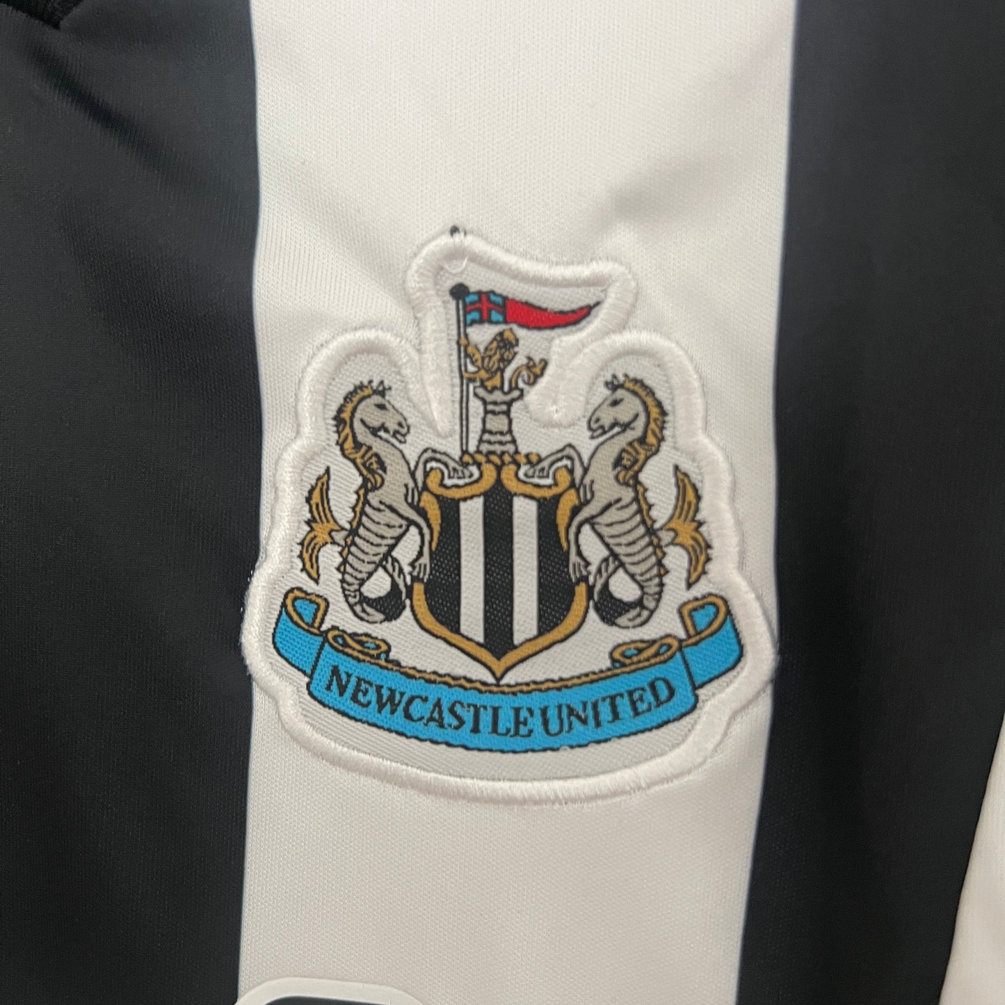 Kit Infantil Newcastle Titular 24/25